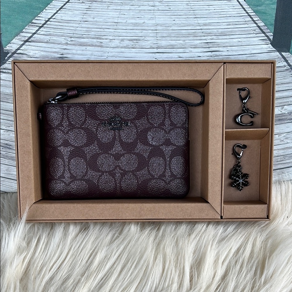 Coach Signature Burgandy Wristlet with Charms